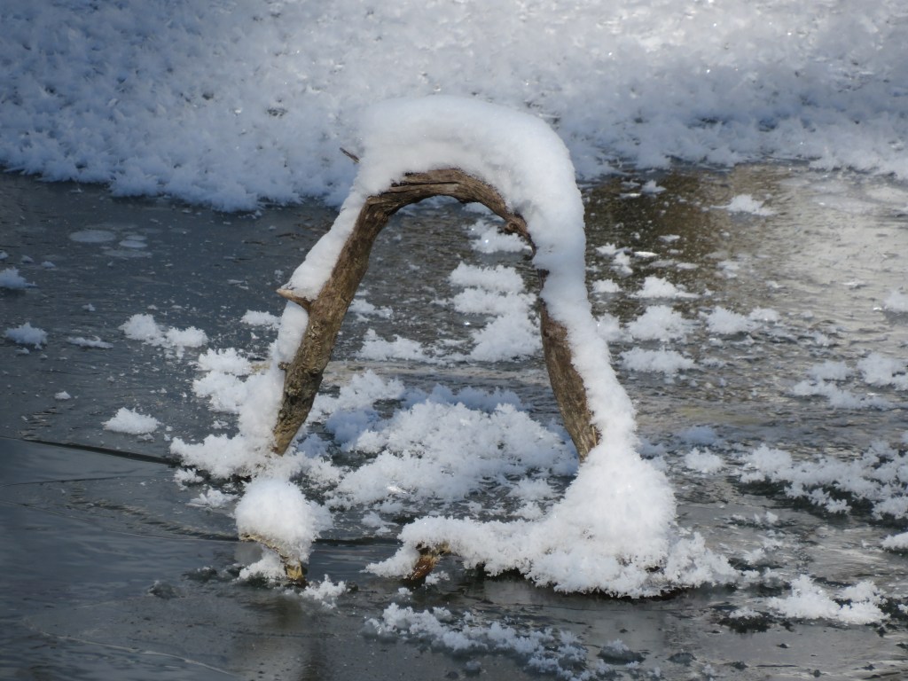 Photo of natural arch in river.